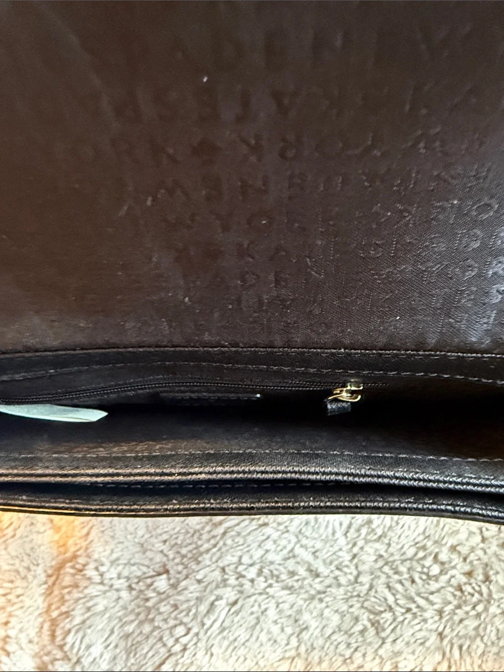 kate spade black crossbody with gold plaque